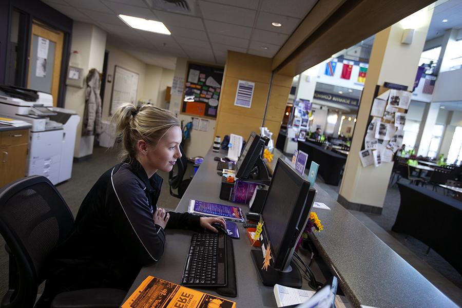 A student works at a desk in the University Center.