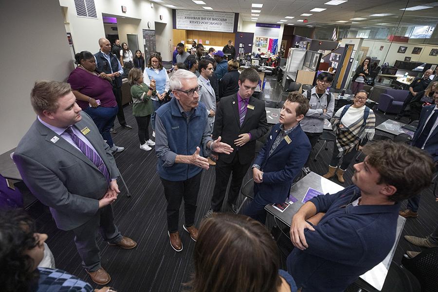 Members of Whitewater Student Government stand and talk with the Wisconsin governor.